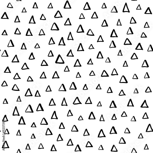 Artistic hand drawn seamless ink pattern. Repeatable doodle triangle sketch design for print, textile, wrapping paper, invitation card background, fashion fabric. Black and white brush strokes.