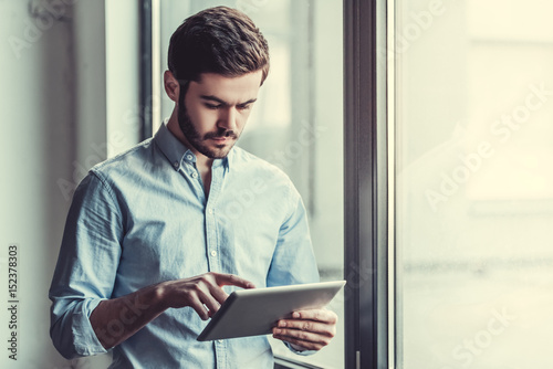 Man with tablet photo