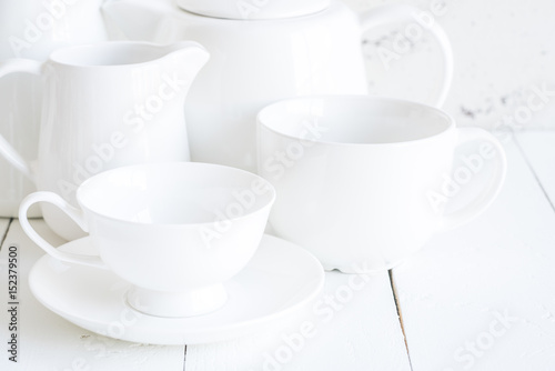 Clean cups on wood background.