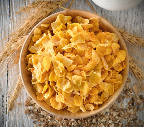 corn flakes in wood bowl photo