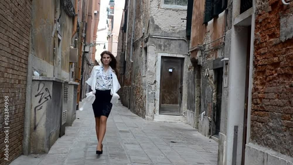 Young model dresses up the streets of venice Italy
She wears a blue skirt and a white shirt Young model dresses up the streets of venice Italy
She wears a blue skirt and a white shirt