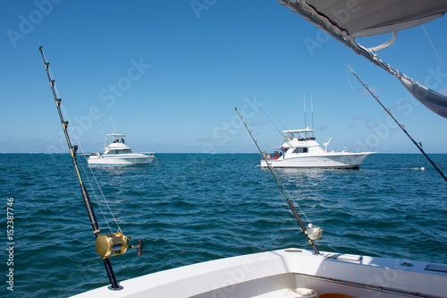 White boat makes fishing with spinning on a large sea fish in the Caribbean Sea