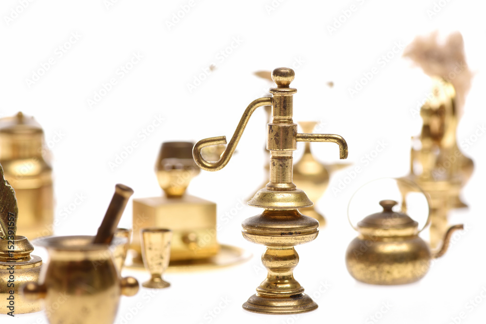 Antique golden jug or lamp with kitchenware Antique golden jug or lamp with kitchenware