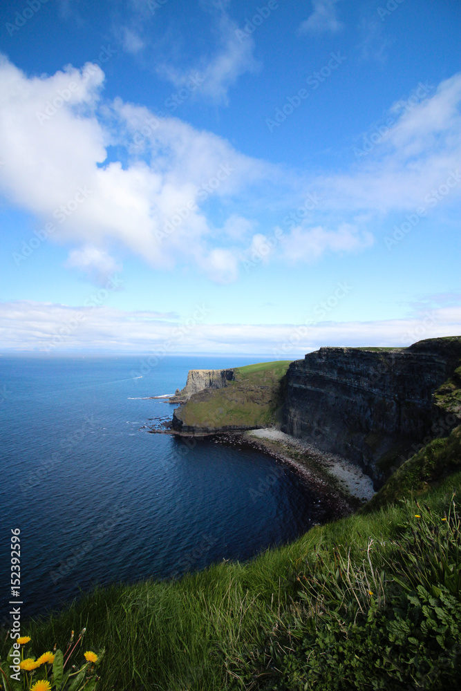 Blue skies above the Cliffs of Moher on a sunny day