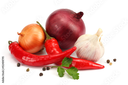 spices onion, garlic and chili pepper isolated on white background