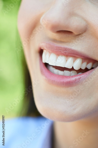 Close Up Of Woman With Beautiful And Perfect Teeth