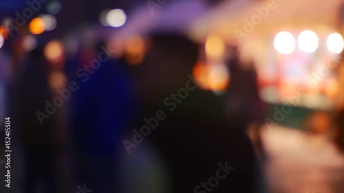 Wallpaper Mural a Busy Street in the Evening City With Car Headlights and Dark Silhouettes People Blurred Background of Brightly Colored Lighting. Out Focus, Blurry Torontodigital.ca