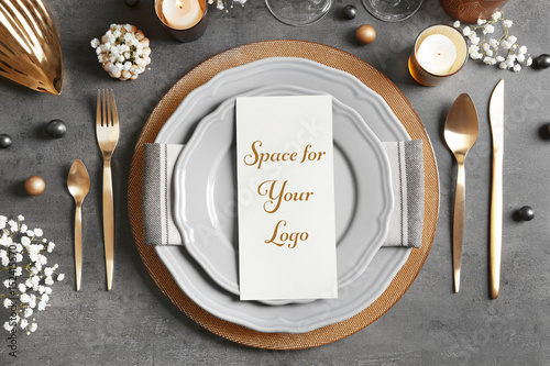 Beautiful table setting on grey background