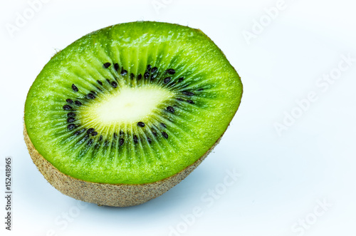 Juicy kiwi fruit sliced on white