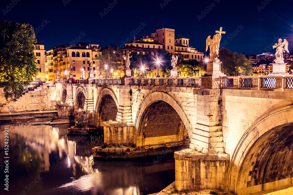 The famous Ponte Vittorio Emanuele II leading to St. Angelo Castle at night, Rome, Italy.