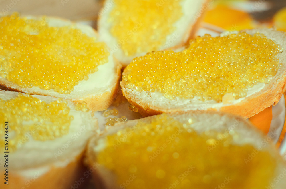 Sandwich of bread, butter and pike caviar. Close-up, selective focus. Sandwich of bread, butter and pike caviar. Close-up, selective focus.