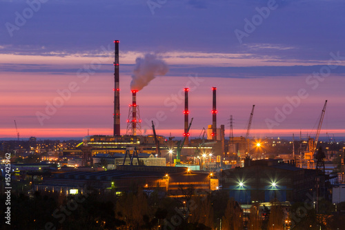 Chimneys of heating plant in Gdansk at sunset, Poland