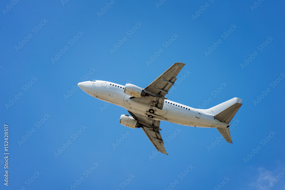 plane flies in the blue sky plane flies in the blue sky