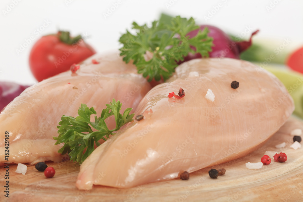 Raw chicken breast, chicken white meat with red and black pepper Raw chicken breast, chicken white meat with red and black pepper
