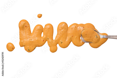 Foto splashes, droplets and spilled russian dressing with a spoon