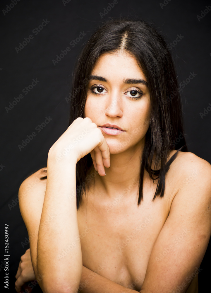 Beautiful naked woman covering her breasts Beautiful naked woman covering her breasts