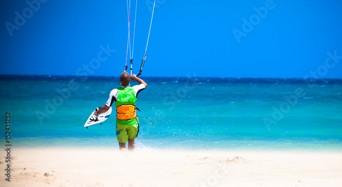 kitesurfer going to water