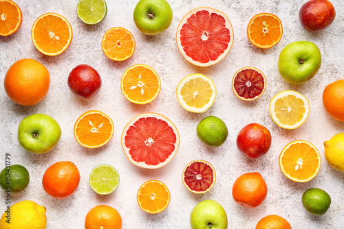 Citrus colorful fruits background mix flat lay, summer healthy vegetarian vitamin food