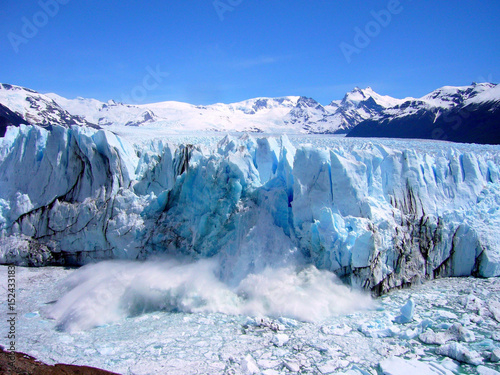 ice breaking off glacier Perito Moreno splashing into Lago Argentino, Los Glaciares national park, patagonia, Argentina photo