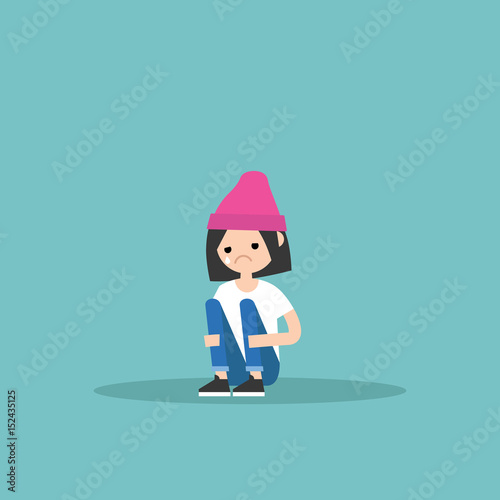 Upset crying girl sitting and hugging her knees / editable flat vector illustration