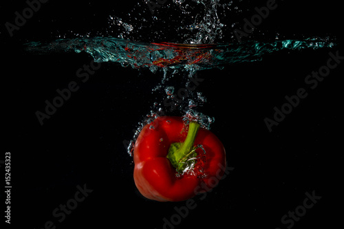 Red Bell Sweet Pepper Droped Into Water
