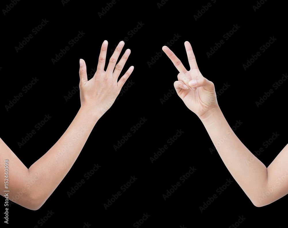 The right back and front side hand of the woman show Rock Paper Scissors sign for find the winners fair in the game. show paper and scissors sign. isolated on black background. The right back and front side hand of the woman show Rock Paper Scissors sign for find the winners fair in the game. show paper and scissors sign. isolated on black background.