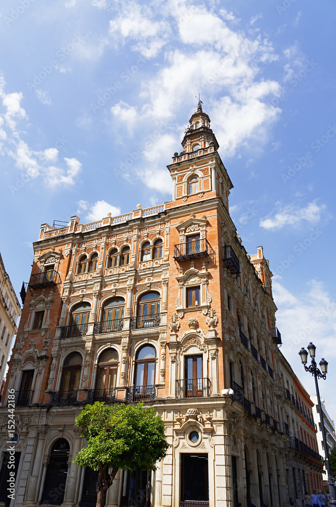 Historic buildings and monuments of Seville, Spain. Architectural details, stone facade.