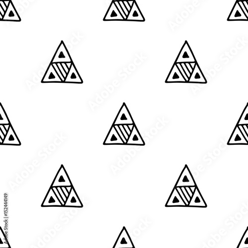 Seamless vector pattern. Black and white geometrical background with hand drawn decorative tribal elements. Print with ethnic, folk, traditional motifs. Graphic vector illustration.