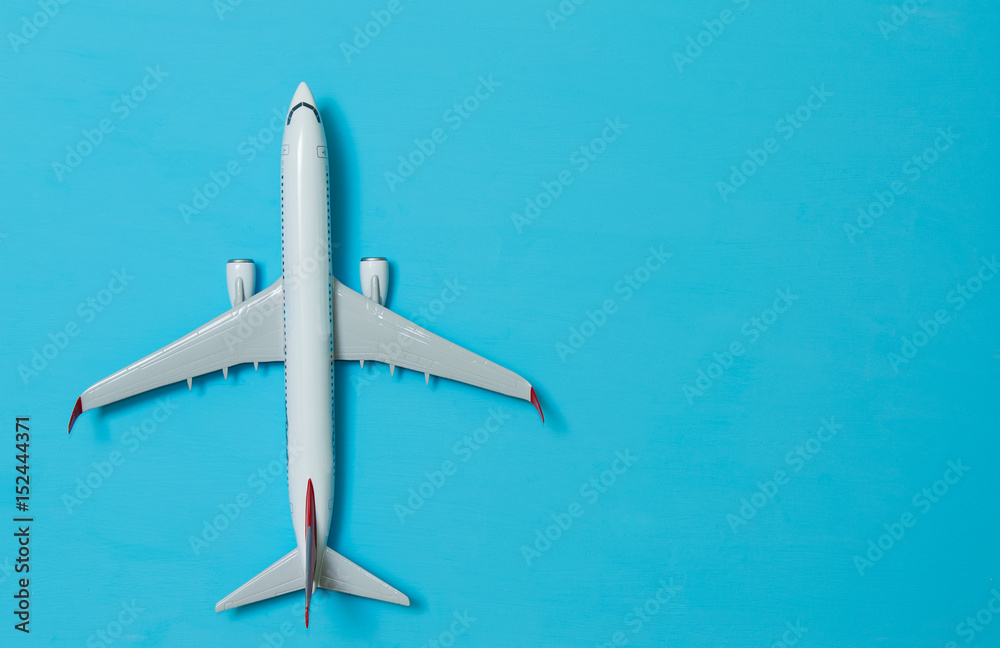 white airplane on a blue background white airplane on a blue background