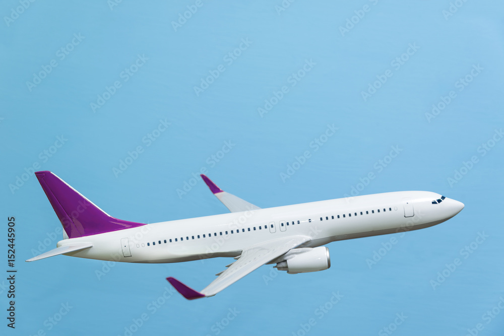 white airplane on a blue background white airplane on a blue background