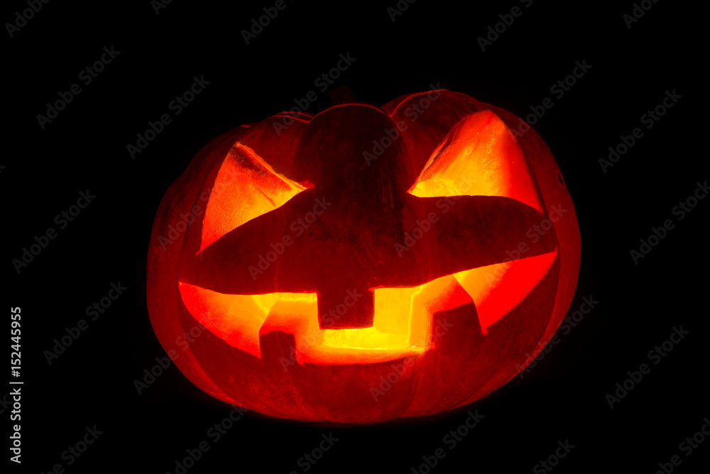 Fototapeta premium scary pumpkin face on dark background