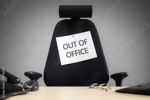 Business chair with out of office sign
