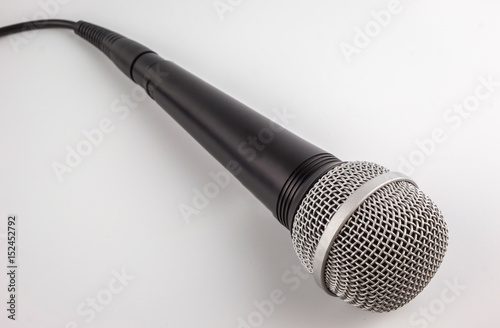 Microphone with a wire isolated on white background.