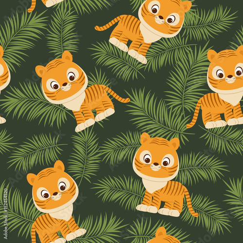 Tiger cub in tropical leaves
