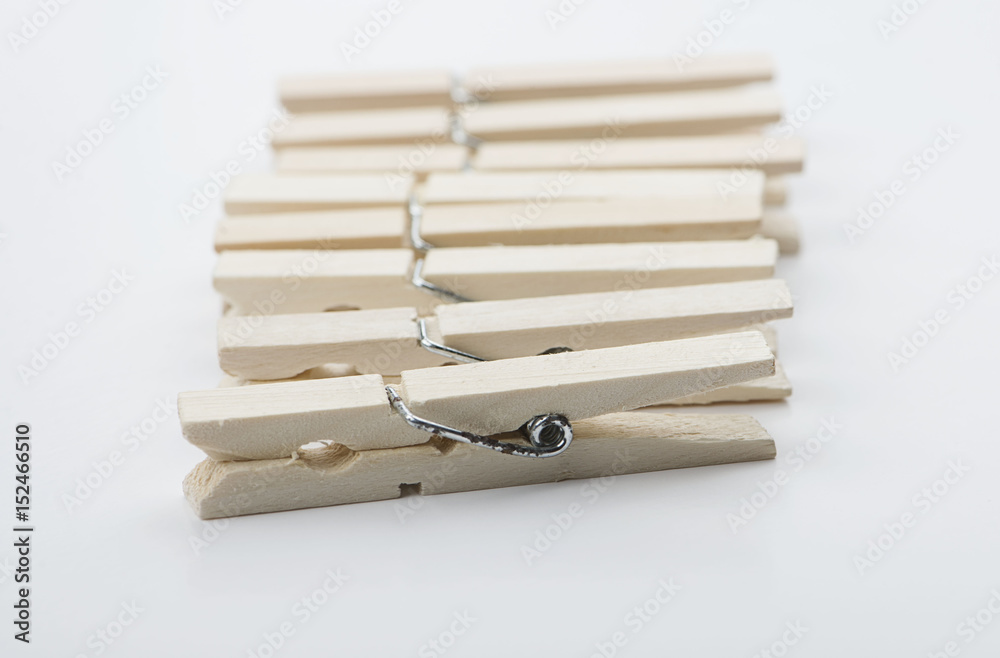 Wooden clothespins on white background. Isolated. Horizontal shoot.