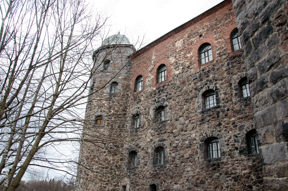Historic Vyborg castle (Finnish, Swedish and Russian rule) on island in Gulf of Finland. Ancient fortifications of the XIII century. Monuments of West European medieval military architecture. Historic Vyborg castle (Finnish, Swedish and Russian rule) on island in Gulf of Finland. Ancient fortifications of the XIII century. Monuments of West European medieval military architecture.