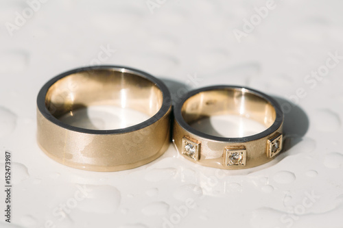 Close up of wedding ring on wooden table
