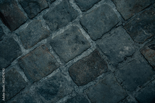 Old cobbles pattern, cobblestone texture, close up view, stone background.
