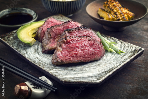 Japanese Kobe Steak Fillet with Rice and Avocado as close-up on a plate