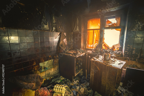 Interior of a burnt by fire apartment in an apartment building  burned furniture 