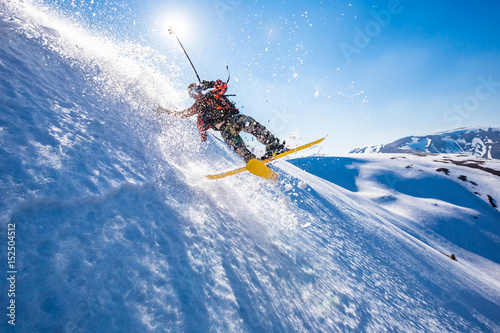 Skiing in the snowy mountains, Carpathians, Ukraine, good winter day, ski jump, fall, ski season photo