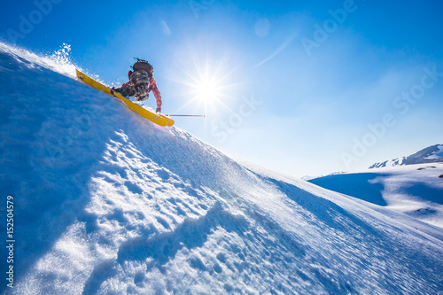 Skiing in the snowy mountains, Carpathians, Ukraine, good winter day, ski jump, fall, ski season