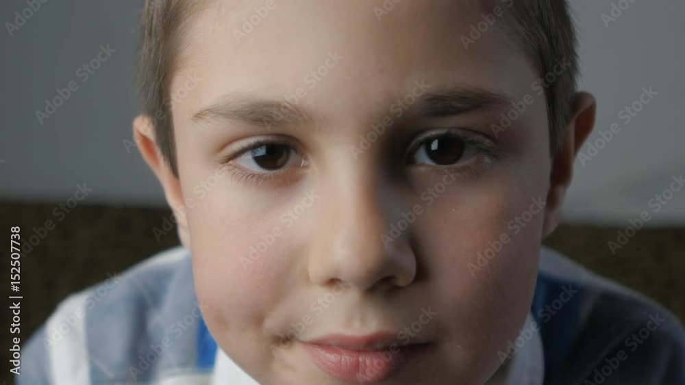 close up portrait of little boy looking at camera close up portrait of little boy looking at camera