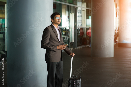 indian male walking at airport