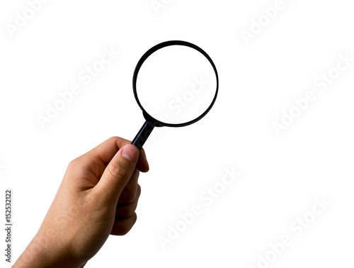 Hand holding magnifying glass, isolated on white background, with clipping path
