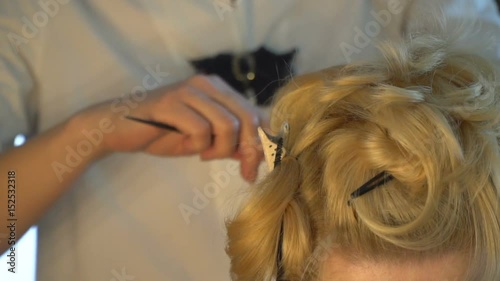 A blonde with beautiful make-up, wears a shiny earring photo