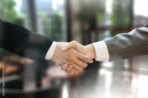 Obraz na płótnie M&A (MERGERS AND ACQUISITIONS) , Businessman handshake working at office M&A