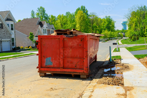 Obraz na plátně Dumpsters being full with garbage