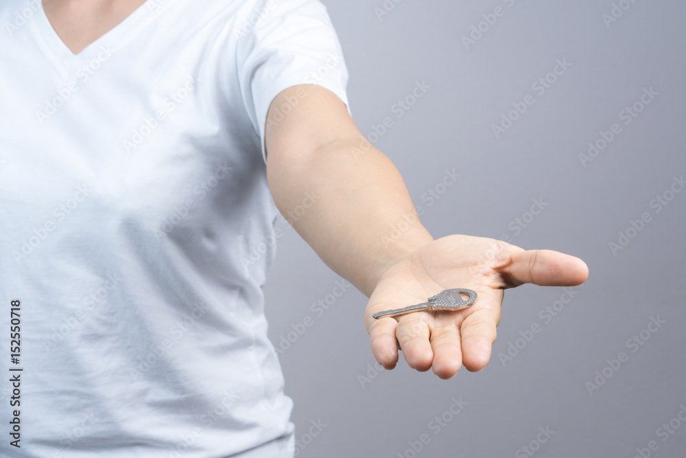 Woman hand giving keys