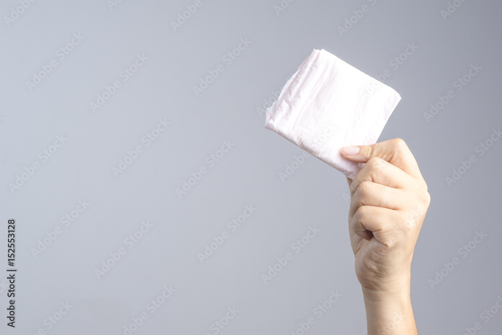 Hand holding sanitary napkin Hand holding sanitary napkin